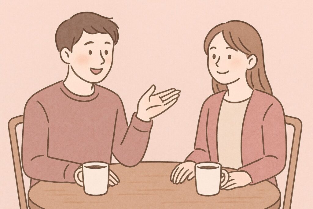 男性が手のひらを少し上げて「割り勘でいい？」と伝えている