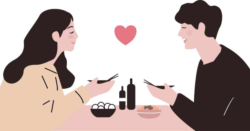 自宅で笑いながら食事をする男女